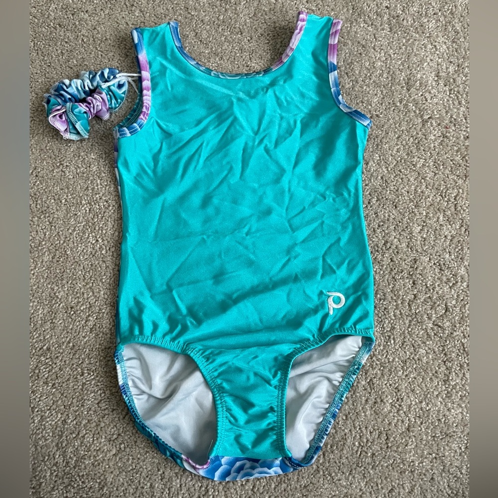 Gently used Plum Practicewear leotard in size child large with scrunchie